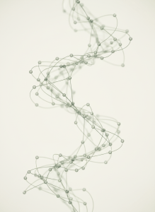 Abstract macro image of a peptide molecular structure rendered as delicate thin lines and soft nodes, floating on a clean pale cream background. Minimal, elegant, scientific, premium biotech feel. Soft sage green and muted grey tones. Bright and airy.